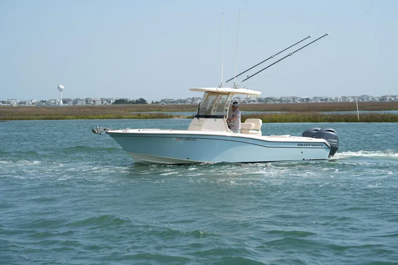 Slide: The Image of 2023 Grady-White Fisherman 257 boat cruising on a scenic waterway. - 4