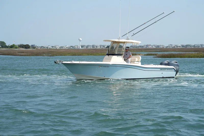 Slide: The Image of 2023 Grady-White Fisherman 257 boat cruising on a calm waterway. - 5