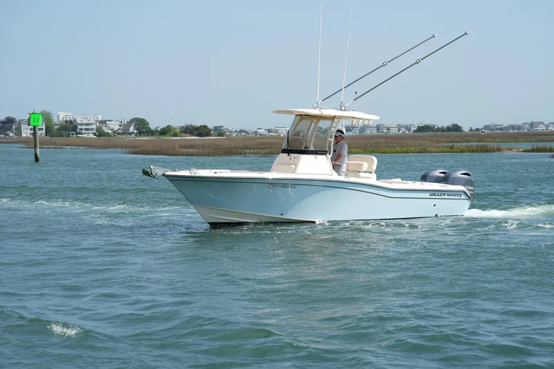 Slide: The Image of 2023 Grady-White Fisherman 257 boat cruising on a calm waterway. - 6
