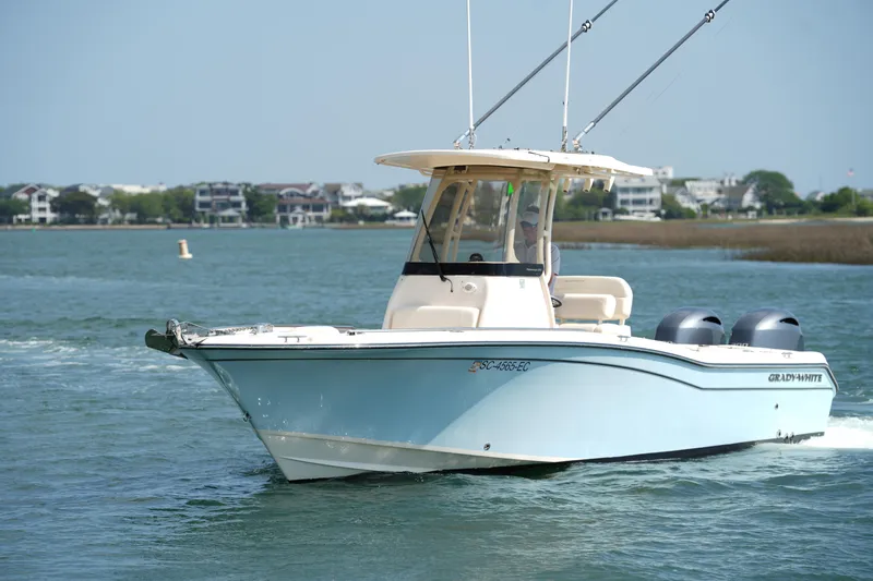 Slide: The Image of 2023 Grady-White Fisherman 257 boat cruising on a scenic waterway. - 8