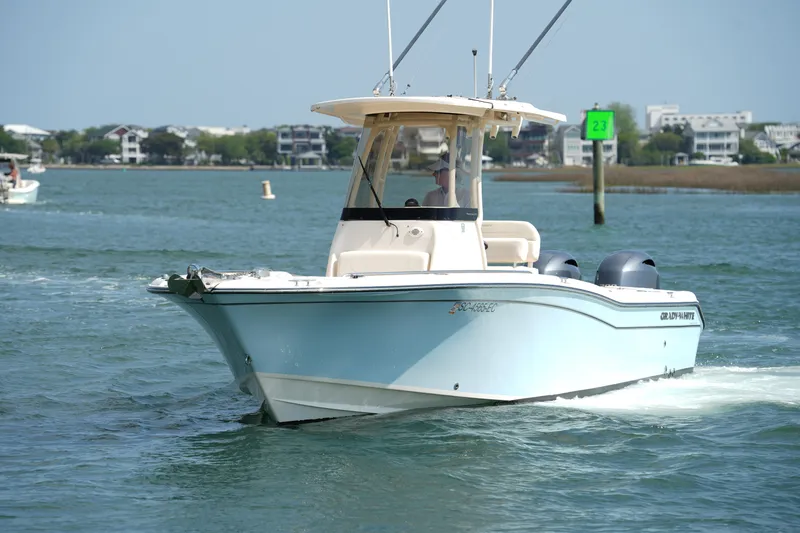 Slide: The Image of 2023 Grady-White Fisherman 257 boat cruising on a sunny day. - 9