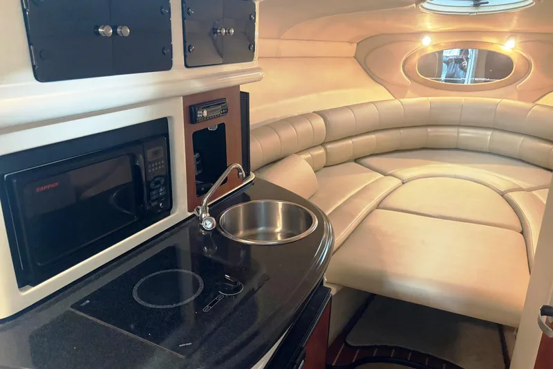 Slide: The Image of Interior of 2008 Monterey 250 Cruiser with kitchenette and cozy seating area. - 13