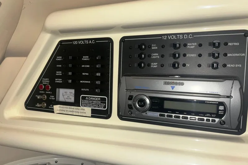 Slide: The Image of Control panel and stereo system on a 2008 Monterey 250 Cruiser boat. - 17