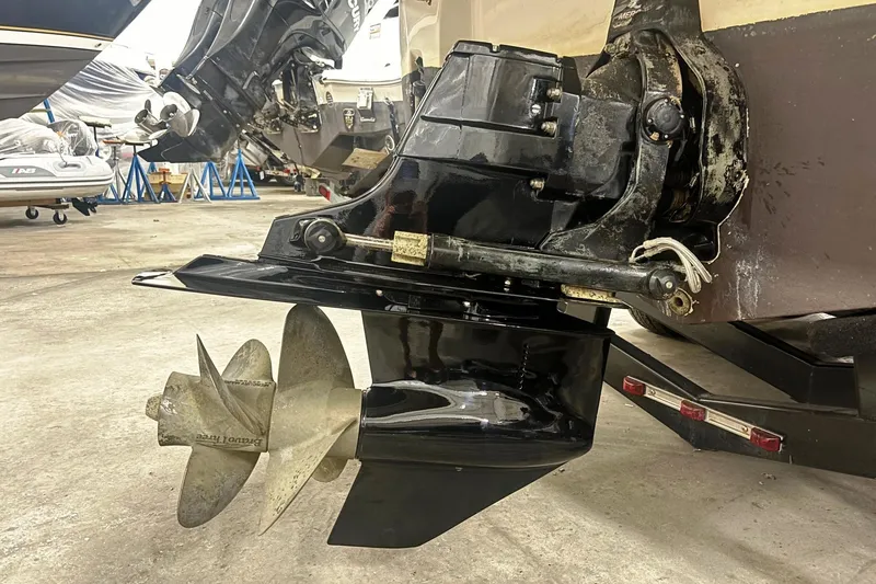 Slide: The Image of 2008 Monterey 250 Cruiser boat propeller and outdrive in a maintenance facility. - 6