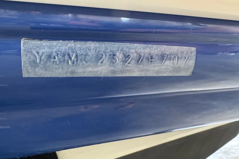 Slide: The Image of 2007 Yamaha Boats SX230 HO hull identification number on blue surface. - 12