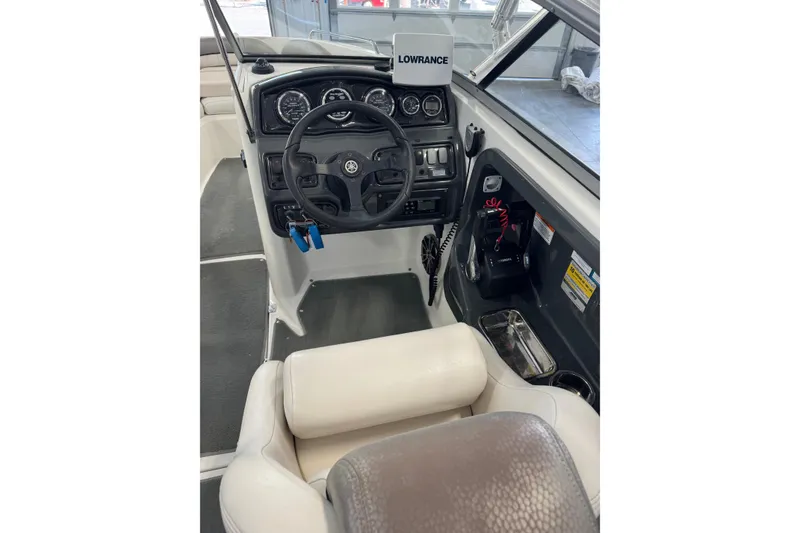 Slide: The Image of 2007 Yamaha Boats SX230 HO cockpit with steering wheel and control panel. - 6