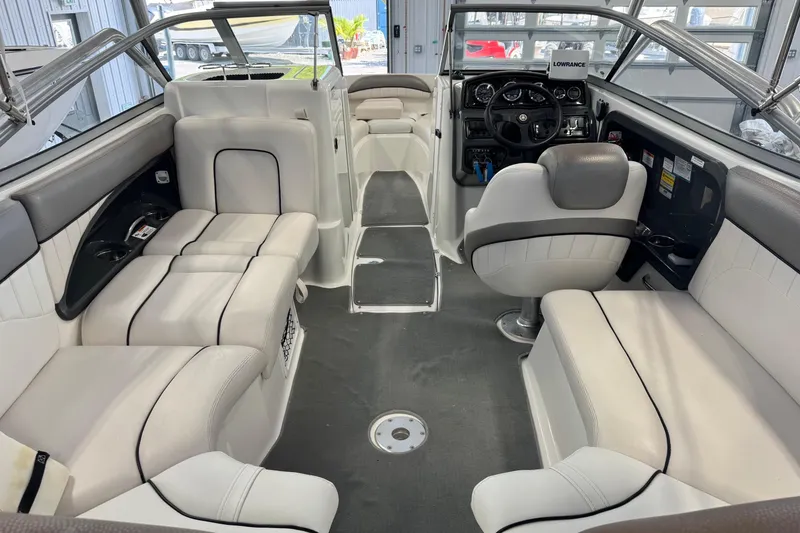 Slide: The Image of 2007 Yamaha Boats SX230 HO interior with plush seating and modern dashboard. - 7
