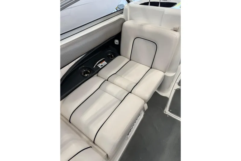 Slide: The Image of 2007 Yamaha Boats SX230 HO interior seating with cup holders and sleek design. - 8
