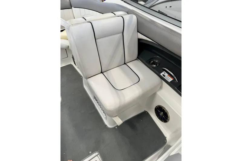 Slide: The Image of 2007 Yamaha Boats SX230 HO interior seat with cup holder and speaker. - 9