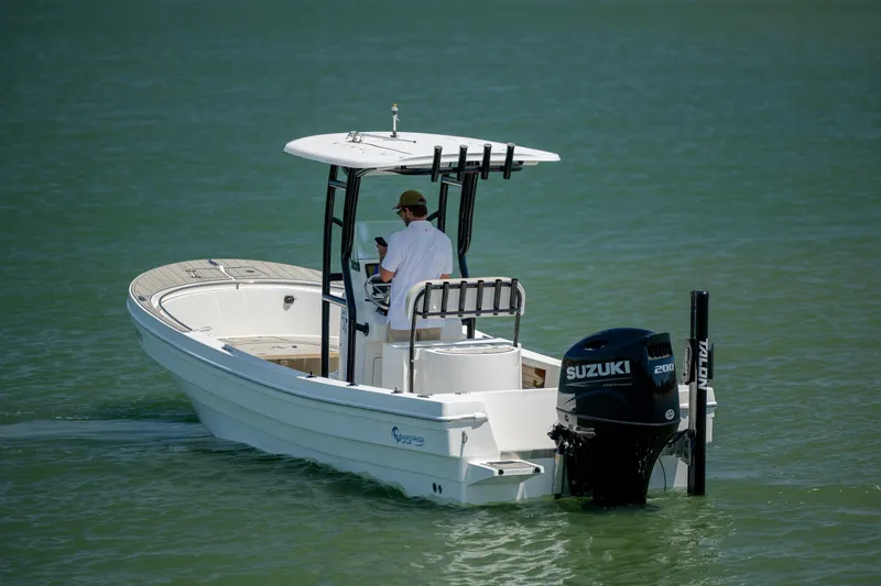 Slide: The Image of 2022 Banks Panga 26 boat with Suzuki engine on calm water. - 7