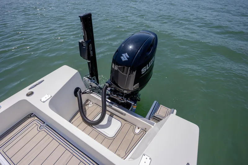 Slide: The Image of 2022 Banks Panga 26 boat with Suzuki outboard motor on calm water. - 8