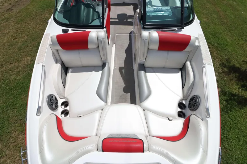Slide: The Image of 2014 MasterCraft X-25 boat interior with red and white seating, viewed from above. - 15