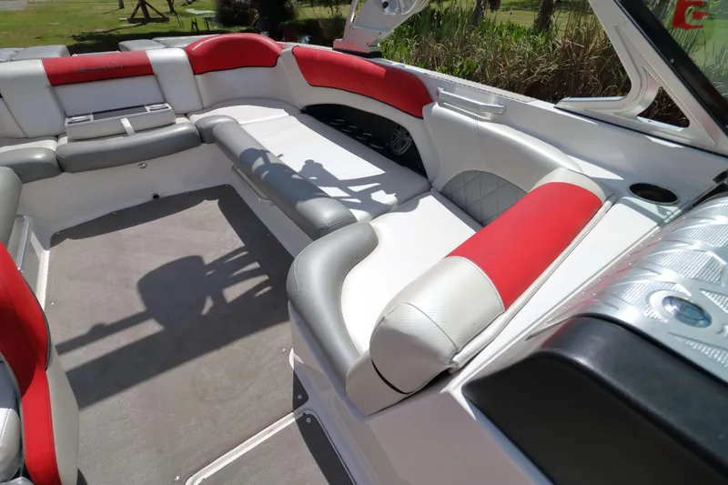 Slide: The Image of 2014 MasterCraft X-25 boat interior with red and white seating, spacious layout. - 17
