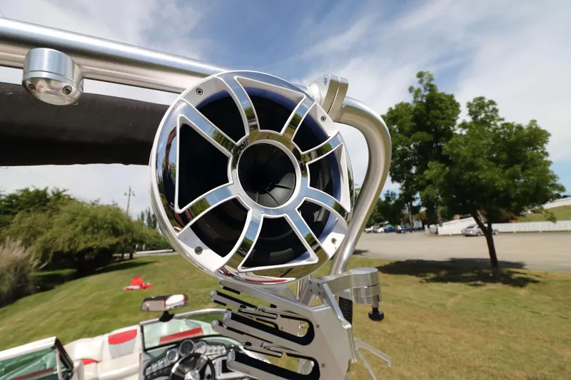 Slide: The Image of Close-up of a 2014 MasterCraft X-25 boat speaker with a scenic outdoor background. - 22