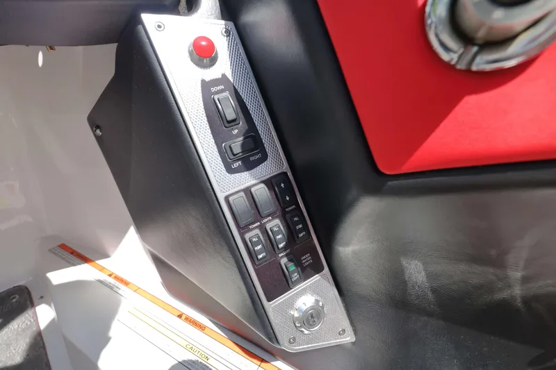 Slide: The Image of Control panel of a 2014 MasterCraft X-25 boat with switches and buttons. - 24
