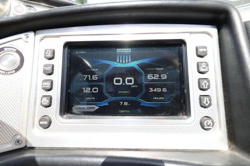 Slide: The Image of Dashboard display of a 2014 MasterCraft X-25 boat showing temperature, speed, and voltage. - 25
