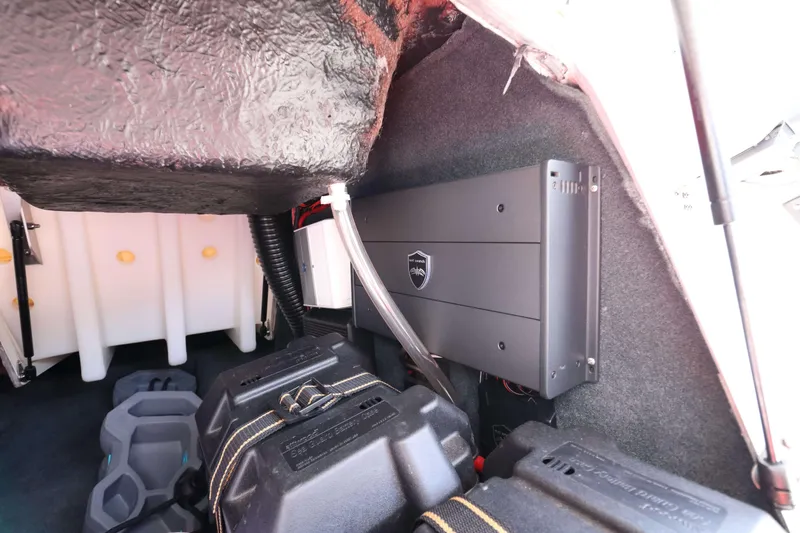 Slide: The Image of 2014 MasterCraft X-25 interior showing storage compartment and equipment setup. - 26