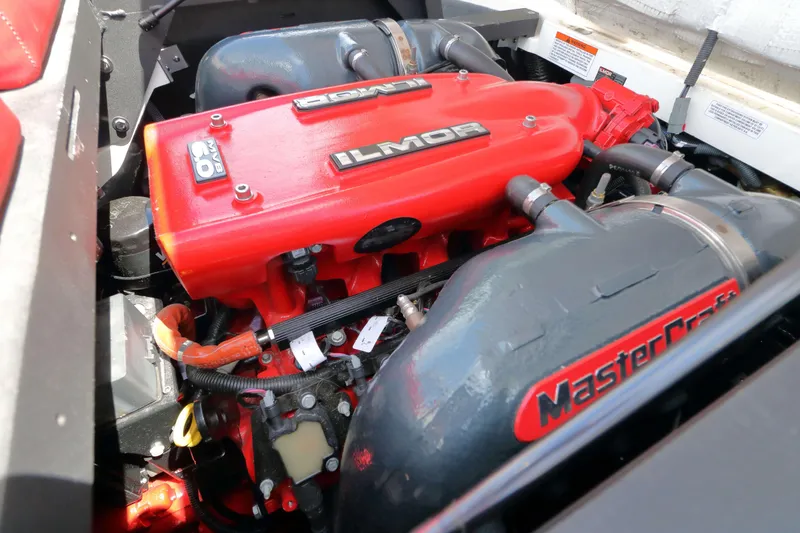 Slide: The Image of 2014 MasterCraft X-25 engine with red Ilmor cover and MasterCraft branding. - 28
