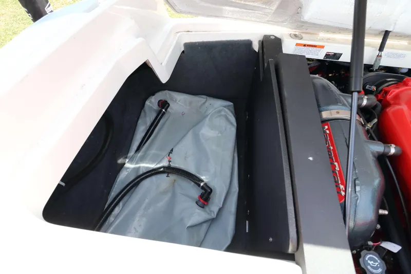 Slide: The Image of 2014 MasterCraft X-25 engine compartment with ballast bag and visible engine components. - 29