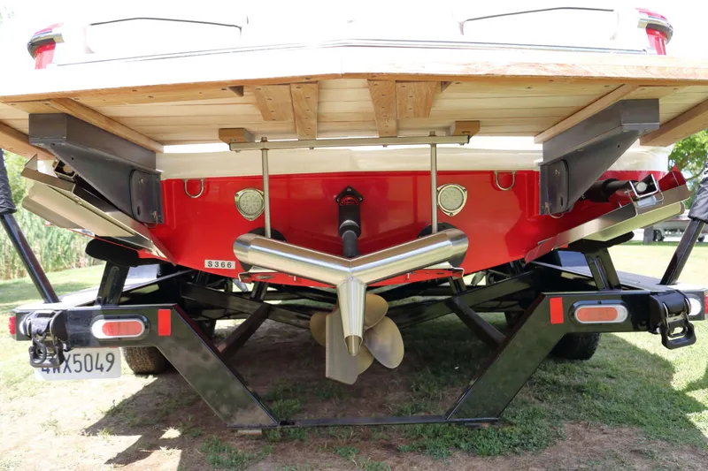 Slide: The Image of Rear view of a 2014 MasterCraft X-25 boat on a trailer, showing propeller and exhaust. - 4