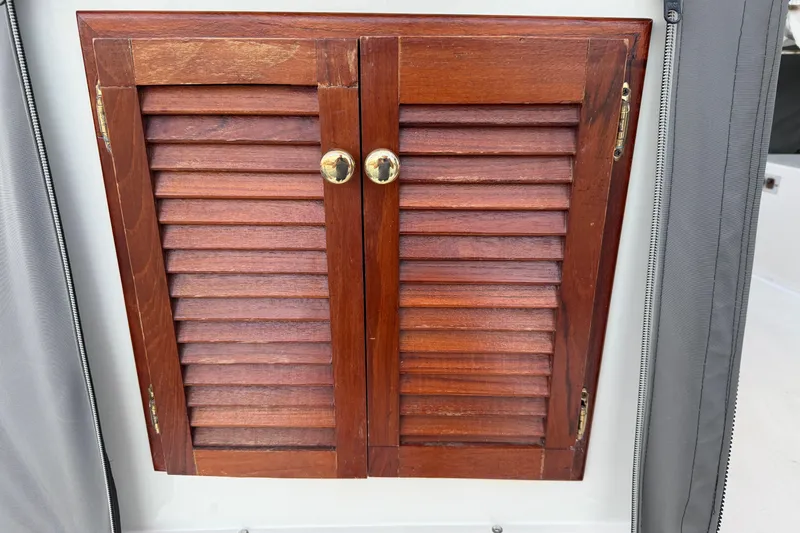 Slide: The Image of Wooden louvered cabinet doors on 1984 Carver 3607 Aft Cabin Motor Yacht. - 12