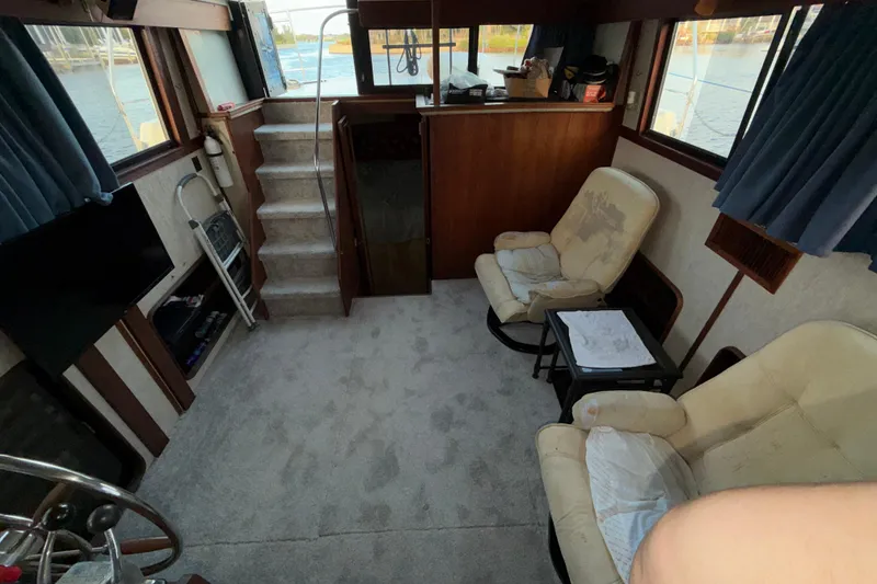Slide: The Image of Interior of 1984 Carver 3607 Aft Cabin Motor Yacht with seating and helm. - 14