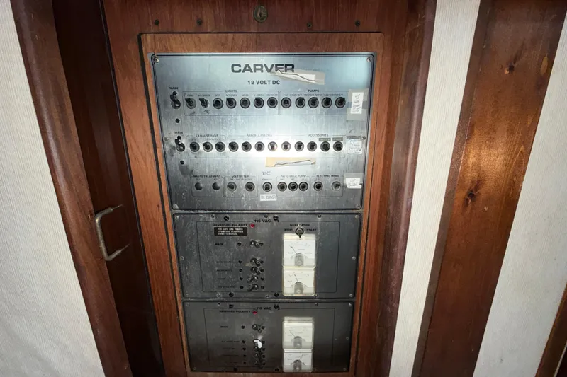Slide: The Image of Electrical panel of 1984 Carver 3607 Aft Cabin Motor Yacht, featuring switches and controls. - 20