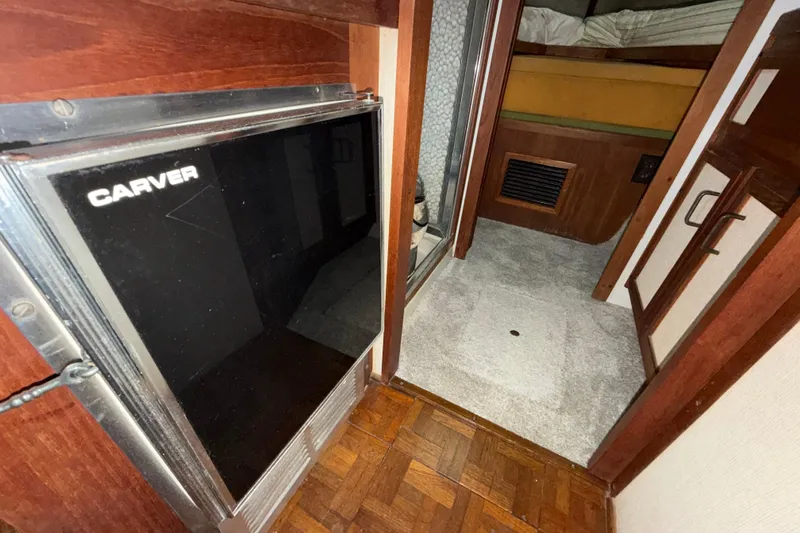 Slide: The Image of 1984 Carver 3607 Aft Cabin Motor Yacht interior with fridge and cabin view. - 27