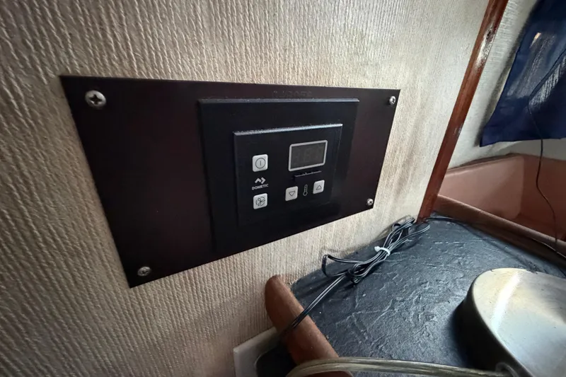 Slide: The Image of Control panel inside 1984 Carver 3607 Aft Cabin Motor Yacht, featuring Dometic system. - 36