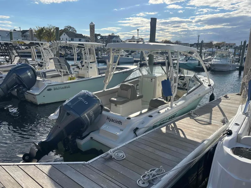 Slide: The Image of 2023 Key West 239 DFS boat docked at marina. - 2