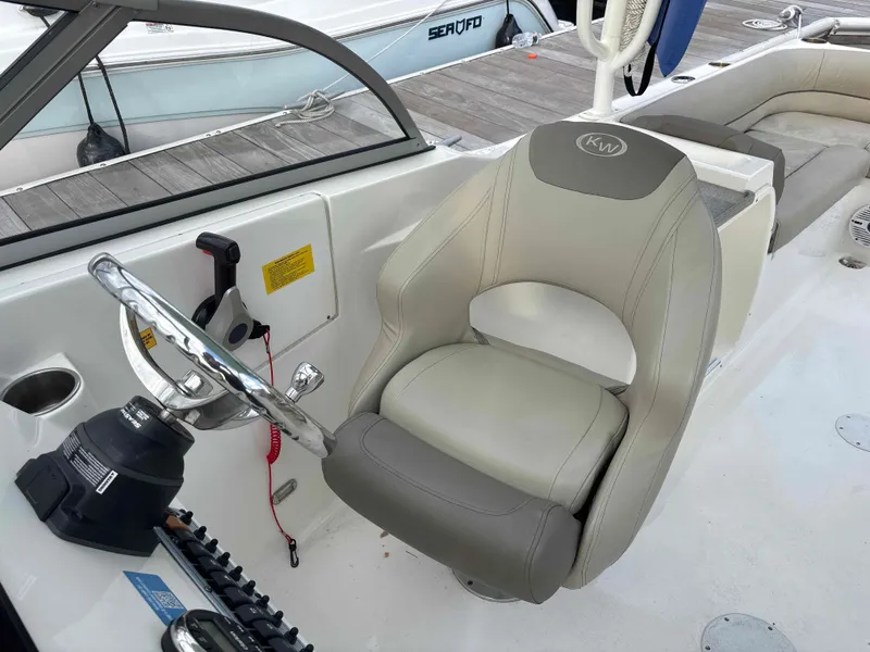 Slide: The Image of Interior view of Key West 239 DFS boat, helm and seat, 2023 model. - 7