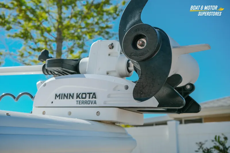 Slide: The Image of Minn Kota Terrova motor on 2018 Barker Boatworks 26 Open under clear blue sky. - 11