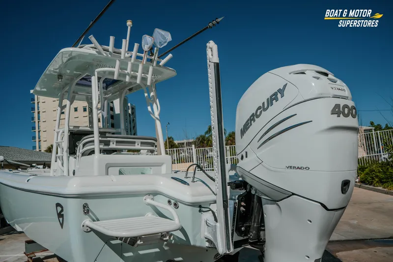 Slide: The Image of 2018 Barker Boatworks 26 Open with Mercury 400 Verado engine, displayed outdoors. - 15