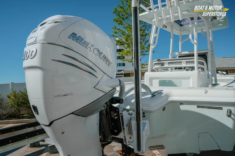 Slide: The Image of 2018 Barker Boatworks 26 Open with Mercury 400 Verado engine, docked outdoors. - 17