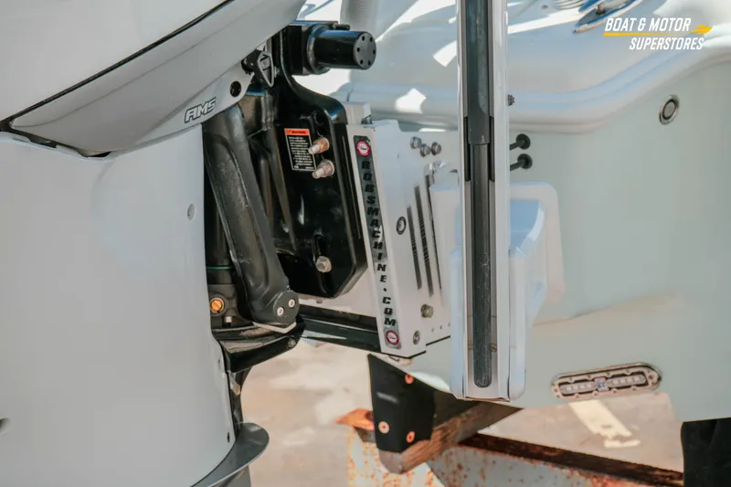 Slide: The Image of 2018 Barker Boatworks 26 Open motor detail, showcasing engine components and mounting. - 18