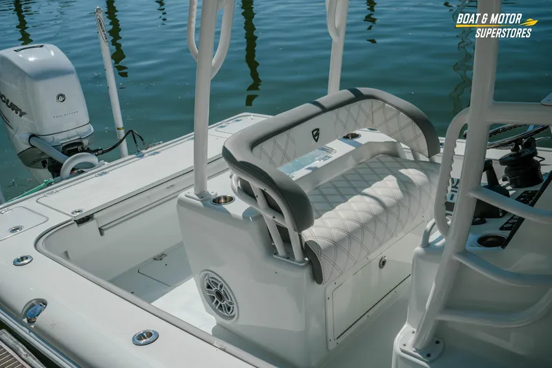Slide: The Image of 2018 Barker Boatworks 26 Open interior with seating and Mercury engine at dock. - 28