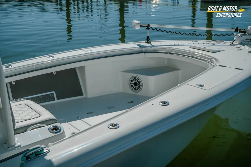 Slide: The Image of 2018 Barker Boatworks 26 Open, sleek design, spacious deck, calm water reflection. - 3