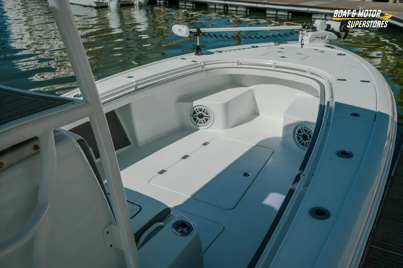 Slide: The Image of 2018 Barker Boatworks 26 Open at dock, showcasing spacious deck and seating area. - 32