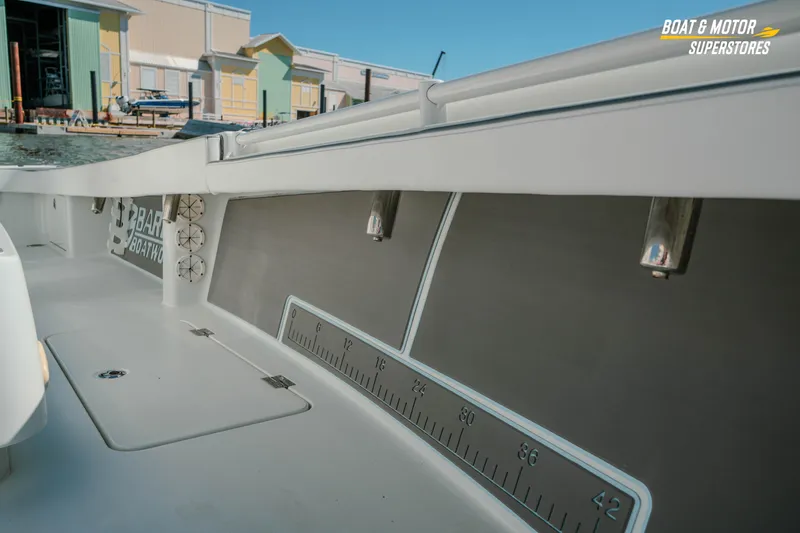 Slide: The Image of 2018 Barker Boatworks 26 Open interior with measurement markings, dockside view. - 33