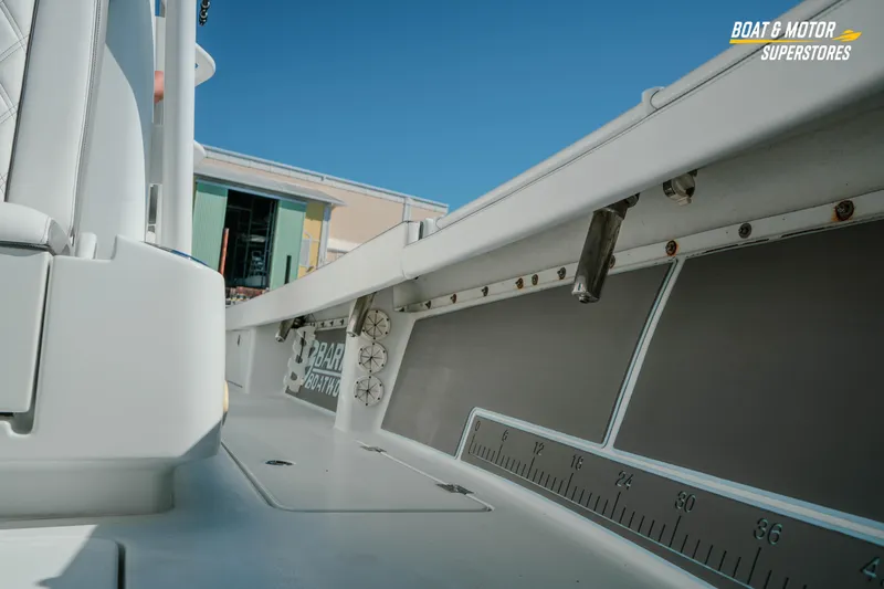 Slide: The Image of 2018 Barker Boatworks 26 Open interior with rod holders and measuring guide. - 34