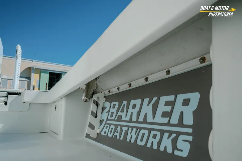 Slide: The Image of 2018 Barker Boatworks 26 Open interior detail with logo, under clear blue sky. - 35