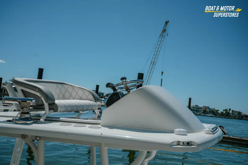 Slide: The Image of 2018 Barker Boatworks 26 Open at dock, featuring sleek design and comfortable seating. - 4