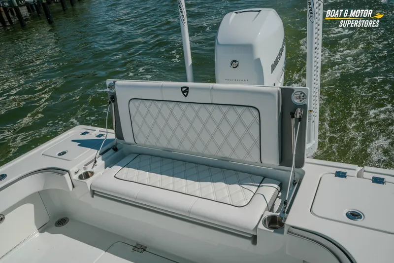 Slide: The Image of 2018 Barker Boatworks 26 Open with cushioned seating and Mercury engine on water. - 40