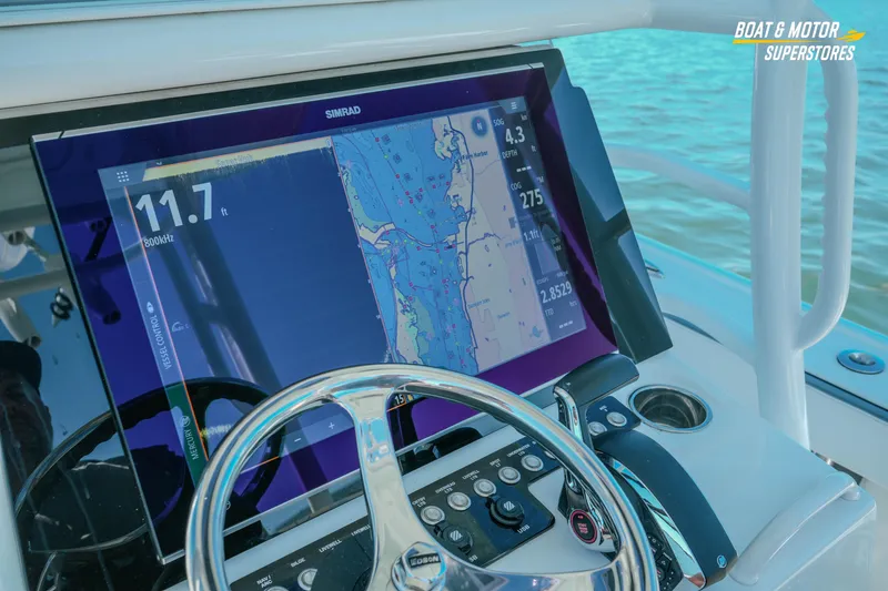 Slide: The Image of 2018 Barker Boatworks 26 Open helm with Simrad navigation display on water. - 45