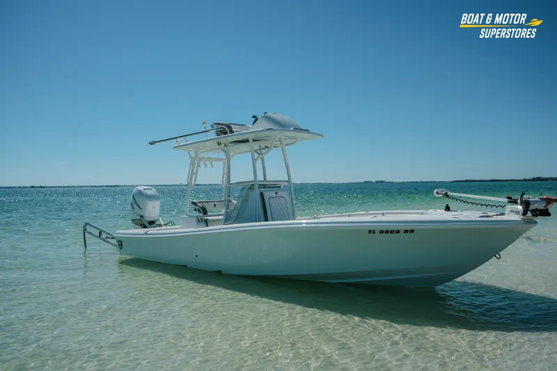 Slide: The Image of 2018 Barker Boatworks 26 Open in shallow water, clear sky, and calm sea. - 49