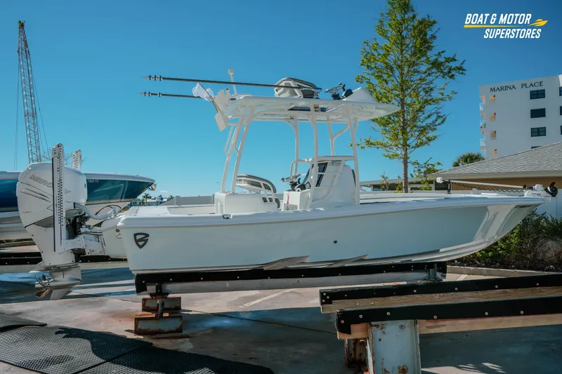 Slide: The Image of 2018 Barker Boatworks 26 Open on display at a marina, featuring sleek design and modern equipment. - 5