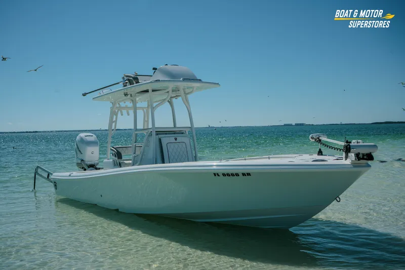 Slide: The Image of 2018 Barker Boatworks 26 Open in clear blue water, with seagulls flying above. - 52