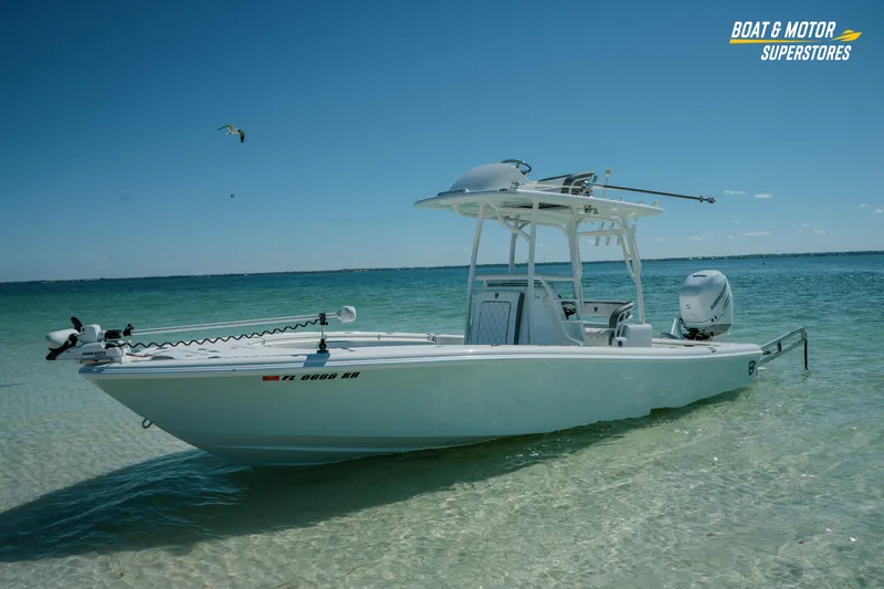 Slide: The Image of 2018 Barker Boatworks 26 Open in clear waters, showcasing sleek design and modern features. - 57