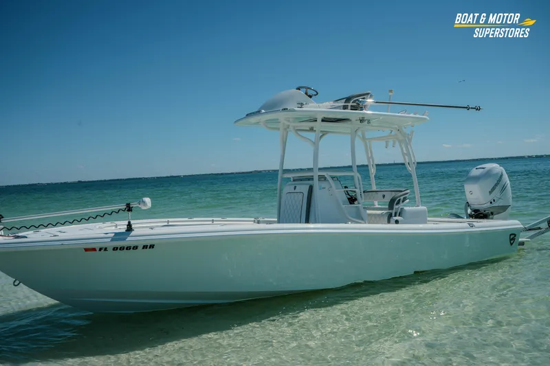 Slide: The Image of 2018 Barker Boatworks 26 Open in clear shallow water, showcasing sleek design and powerful engine. - 59