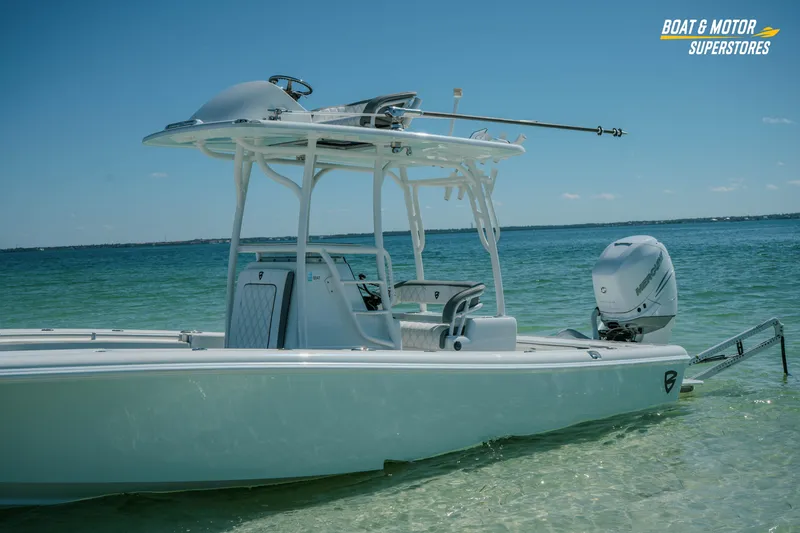 Slide: The Image of 2018 Barker Boatworks 26 Open in clear waters, showcasing sleek design and powerful engine. - 60